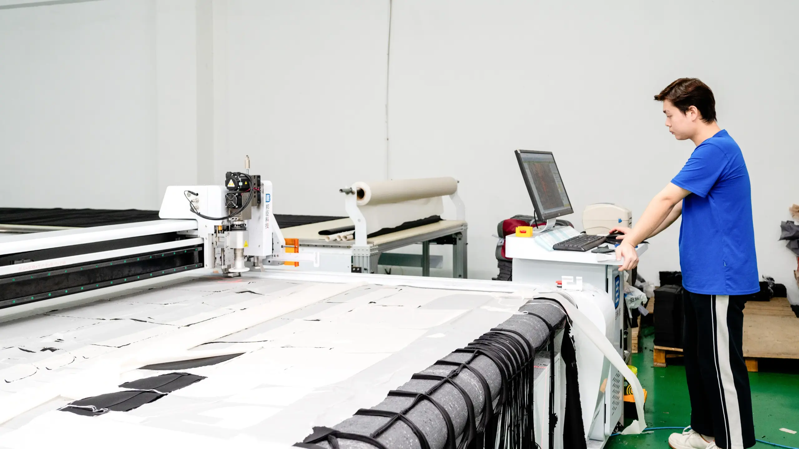 Automated fabric cutting for consistent school bag panels