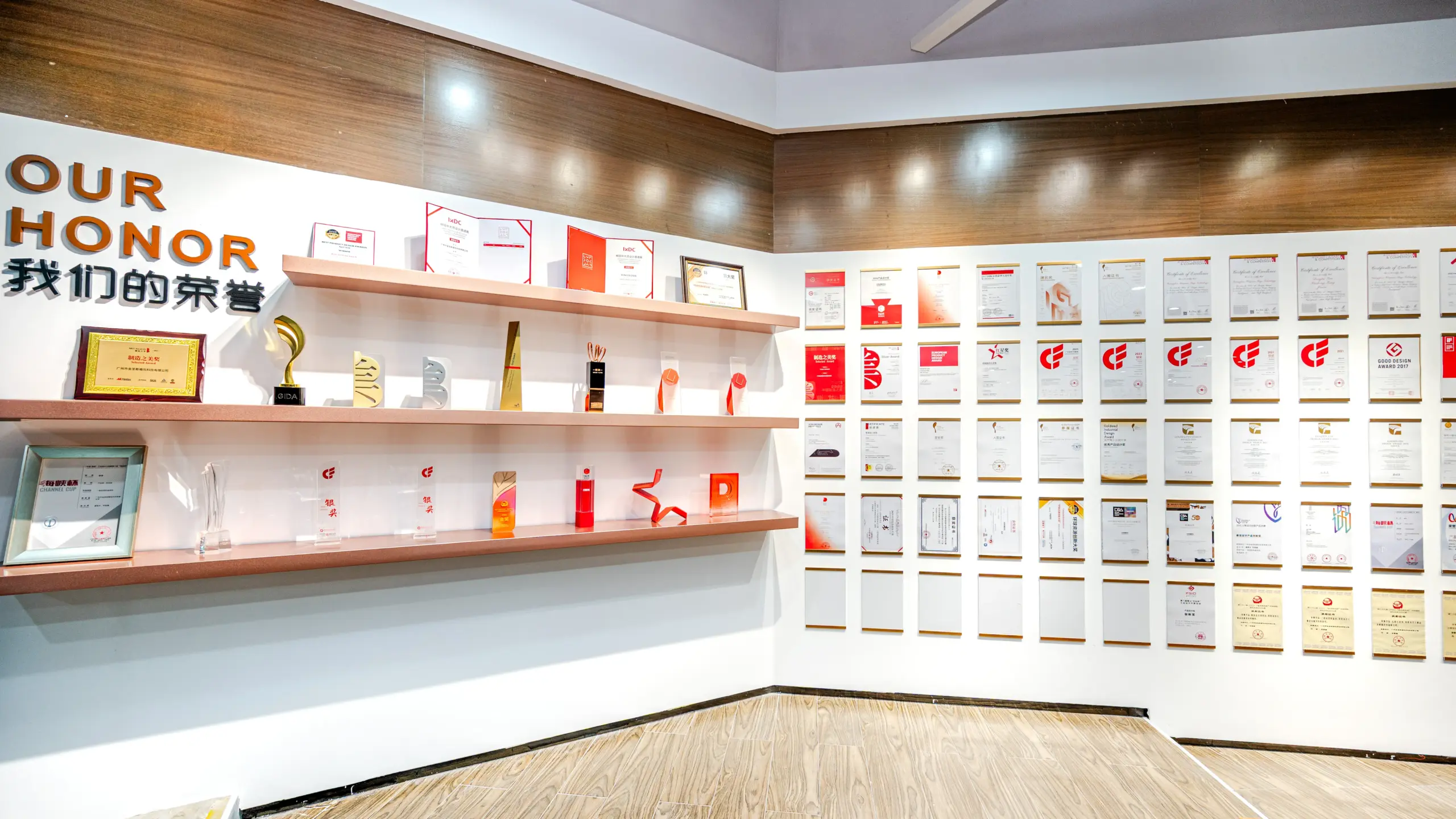Wall display of certification documents and audit awards at a bag manufacturer