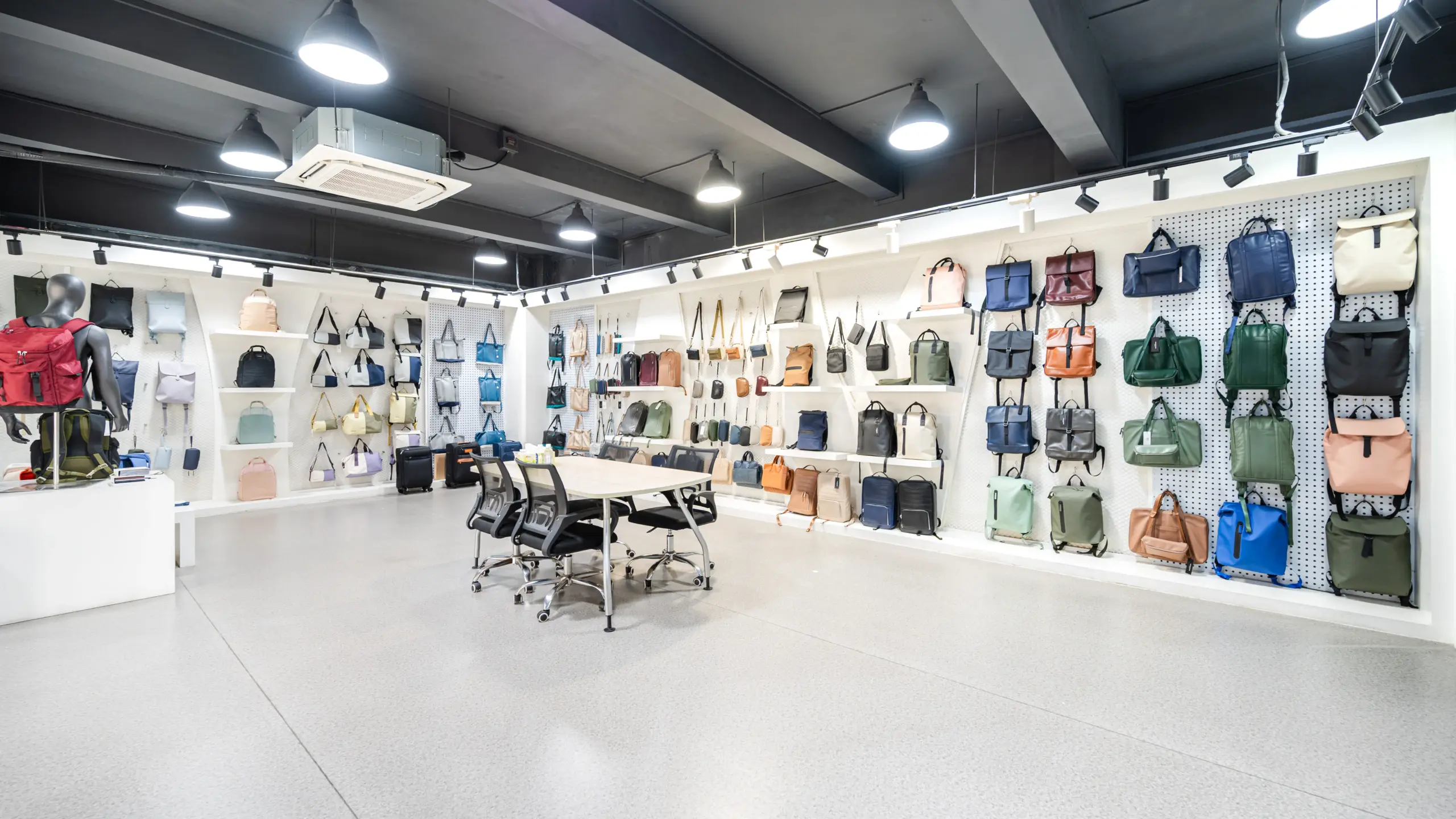 Custom bags and handbags displayed in a manufacturer showroom for bulk buyers