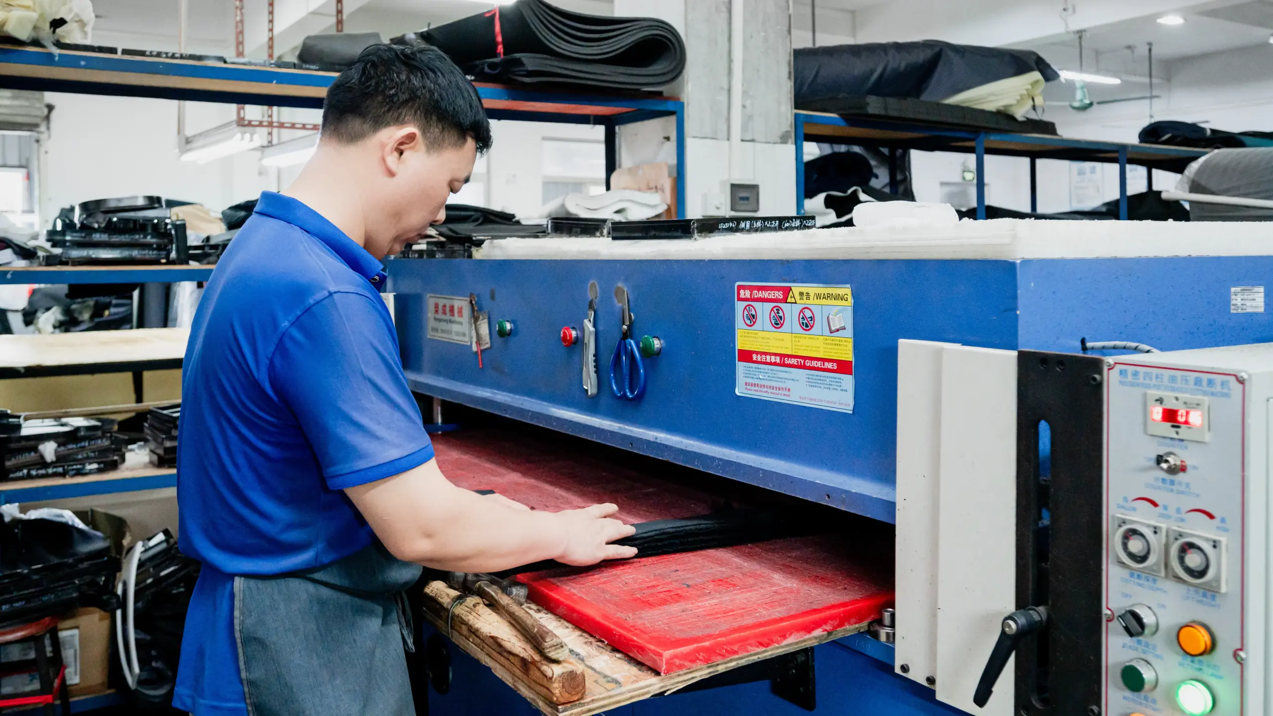 Cutting-room operator at a bag factory that has passed Walmart factory audit