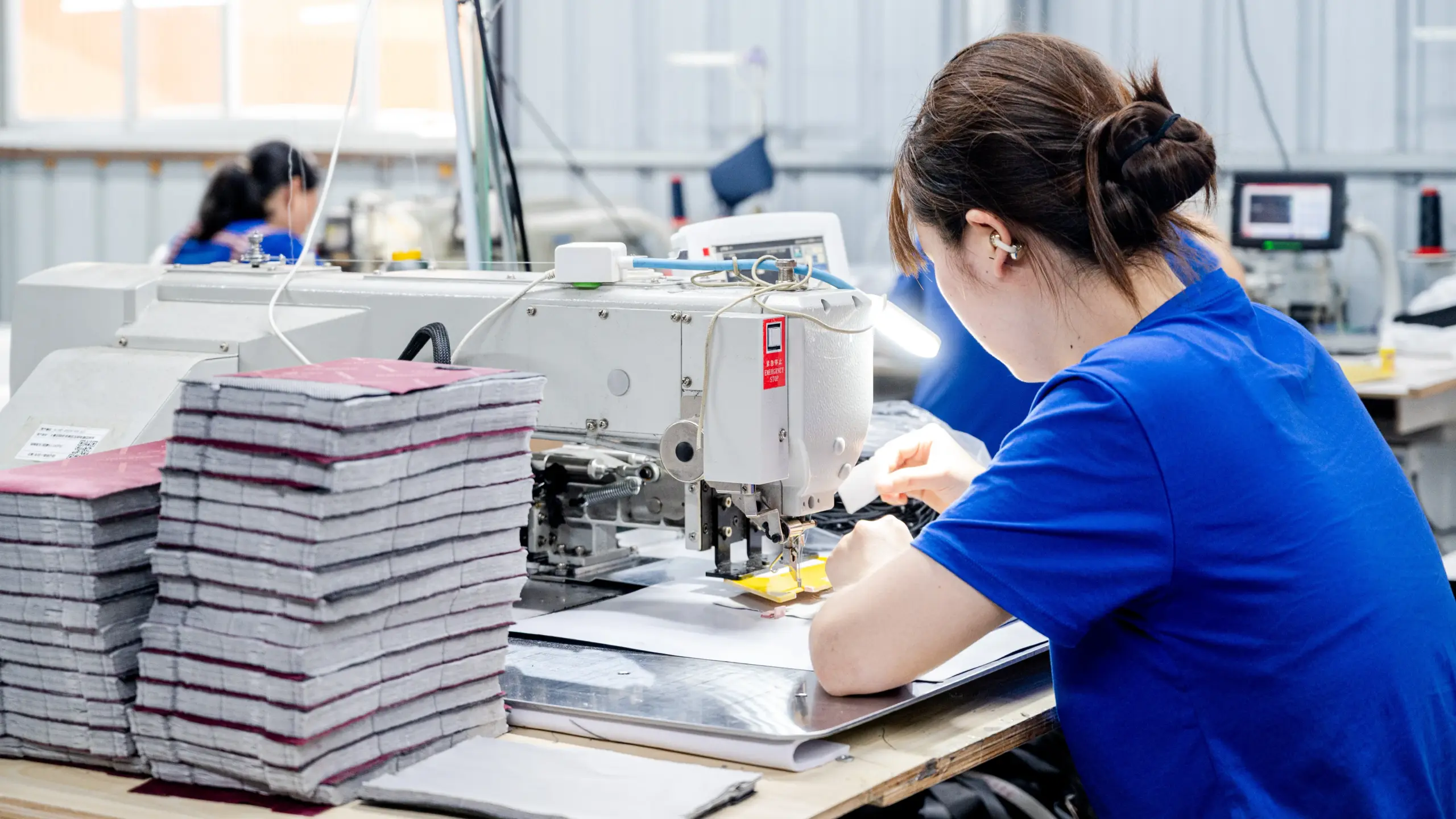 Sewing operator at a bag factory, a station social auditors inspect for hours and safety findings