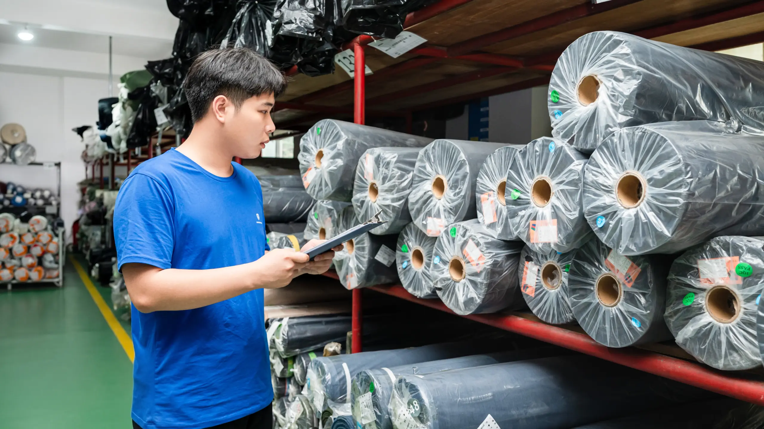 Raw leather and fabric material selection and inspection at a handbag factory